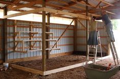 a man is standing on a ladder working on the inside of a building with wood planks