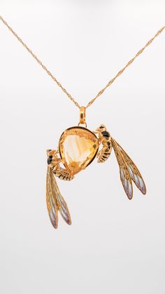 "Pendant \"Bees on a drop of honey\" is made of silver and plated with 24 carat gold. Natural citrine inlay 19.80 carats. the bees are decorated with hot enamel using the \"plique a jour\" and \"Champleve\" technique." Honey Necklace, Insect Fashion, Plique A Jour, Bijoux Art Nouveau, Nouveau Jewelry, Art Nouveau Jewelry, Bugs And Insects, Natural Citrine, Wasp