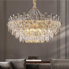 a chandelier hanging from the ceiling in a living room