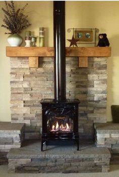 a fire place sitting in the middle of a living room