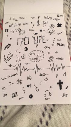 a piece of paper that has some drawings on it with words and symbols drawn on it