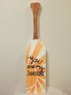 a bottle shaped sign that says you are my sunshine