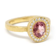 This 18k gold Lux plus ring features an 8x6mm pink sapphire accented with round full cut white diamonds. Our Lux plus rings feature a more substantial band to accommodate deeper full cut gemstones. Stacks perfectly with the Hewn Hammered 2x2 Plain Band. Pictured in:18k yellow gold1.3ct pink sapphire.16ctw white diamonds2mm x 1.5mm wide band Jennifer Dawes Design curates the most beautiful collection of diamond and precious gemstones available for all of our designs. Many of our stones are one of Pink Oval Jewelry With Single Cut Diamonds, Oval Pink Jewelry With Single Cut Diamonds, Pink Sapphire Ring With Single Cut Diamonds, Oval Pink Sapphire Jewelry For Anniversary, Oval Pink Sapphire Ring For Wedding And Anniversary, Pink Sapphire Ring, Plain Bands, Recycled Gold, Jewelry Designer