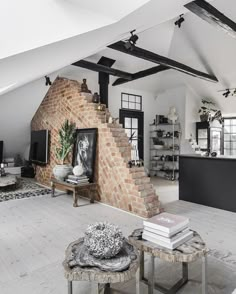 a living room filled with furniture and a fire place