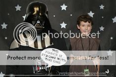 two young boys dressed up as darth vader and stormtrooper from the force is strong with this one