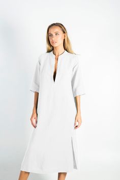 "This carefully tailored women's midi dress is made of cool and light pure linen. It's a stylish outfit for women with distinct taste, for any occasion. NO BUTTONS, NO BUTTONHOLES, NO ZIPS. ZERO SHRINKAGE FITTING: The model appearing in the photo is 176cm (5' 9\") tall and features an S size dress. SMALL Bust (all-around) 111cm/ 43.7\" Waist (all-around) 103cm/ 40.5\" Hips (all-around) 111cm/ 43.7\" Length 120cm/ 47.2\" MEDIUM Bust (all-around) 118cm/ 46.5\" Waist (all-around) 110cm/ 43.5\" Hips Elegant Linen Tunic Dress, Classic Linen Summer Dress, White Linen Short Sleeve Dress For Work, Unlined Linen Dress For Daywear, Elegant Linen Tunic Dress For Daywear, Elegant Tunic Linen Dress For Daywear, Elegant Linen Dress For Daywear, Elegant Linen Dress For Beach, Classic Linen Dress With Short Sleeves