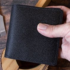 Introducing sophisticated Black Epsom and Chevre Bifold Wallet for Men, a sleek and stylish accessory designed to elevate your everyday essentials. Meticulously handcrafted with a blend of premium materials, this minimalist wallet seamlessly combines the durability of Epsom leather with the luxurious texture of Chevre leather. Crafted for the modern gentleman who appreciates both functionality and aesthetics, this bifold wallet offers a thoughtfully organized interior. The interior features dedi Business Card Holder With Coin Pocket, Mens Slim Wallet, Slim Wallet Men, Wallet Luxury, Wallet Minimalist, Wallet For Men, Luxury Wallet, Clip Wallet, Modern Gentleman