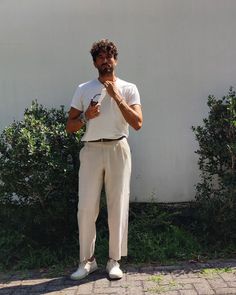 man in white t-shirt and light-colored pants Men's Tshirt Outfit, Mens Outfits White Shirt, Men Clothing Styles Summer, T Shirt And Pants Outfits Men, Polo Jeans Men, Style With Sneakers, Formal Summer Men Outfit, White T Shirt Summer Outfit, White And White Outfit