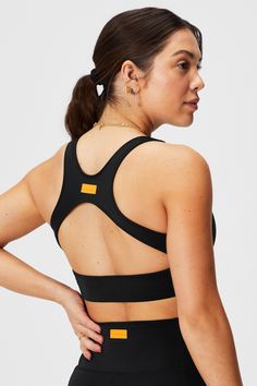 Sporty Racerback Shaping Swim Tank Fabletics black/orange female Activewear >> Womens >> Swim >> Tops regular Swim 4-Way Stretch/Removable Bra Cups Racerback swim tank. Padded Back Activewear For Yoga, Fitted Workout Activewear With Padded Back, Fitted Racerback Activewear With Padded Back, Stretch Activewear With Padded Back For Workout, Workout Stretch Activewear With Padded Back, Stretch Activewear With Padded Back For Sports, Sporty Yoga Activewear With Padded Back, Sporty Activewear With Padded Back For Workout, Stretch Racerback Activewear With Padded Back