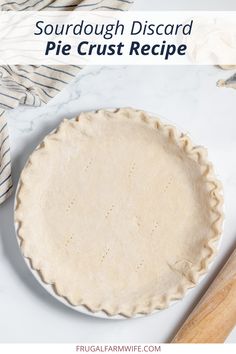 an uncooked pie crust on top of a marble counter with the words sourdough discard pie crust recipe