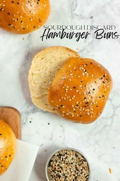 two loaves of hamburger buns with sesame seeds and sprinkles