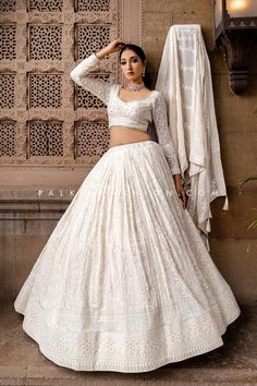 Embrace timeless elegance with this exquisite cream designer lehenga choli from Palkhi Fashion, a perfect blend of traditional craftsmanship and contemporary style. The lehenga is adorned with intricate chikankari and elegant thread work, beautifully complemented by petite sequin embroidery that adds a subtle shimmer. The full-sleeve blouse stands out with its trendy design and appealing patterns, making it a perfect choice for fashion-forward occasions. Complete the look with the matching dupat Fitted Off White Lehenga With Resham Embroidery, Unstitched Cream Georgette Lehenga, Designer White Lehenga With Chikankari Embroidery, Designer Chikankari Embroidered White Lehenga, Elegant Cream Lehenga With Chikankari Embroidery, Traditional Cream Lehenga With Chikankari Embroidery, Traditional Cream Lehenga With Chikankari, Off White Chikankari Embroidery Lehenga For Navratri, Off White Chikankari Lehenga For Navratri