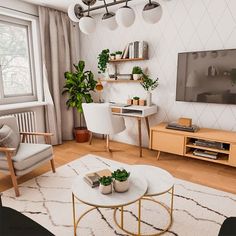 a living room filled with furniture and a flat screen tv mounted on a wall above a wooden coffee table