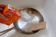 someone is pouring sugar into a pan with food in it