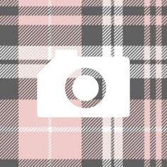 a camera is shown in the middle of a plaid pattern