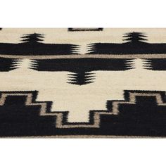 a black and white rug with geometric designs