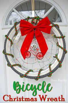 a bicycle christmas wreath hanging on the front door