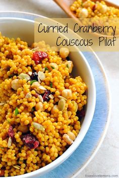 a bowl filled with corn and nuts on top of a table