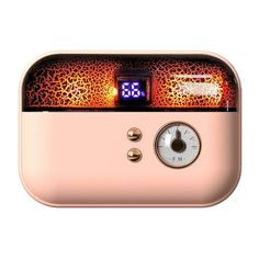 the clock is on top of the pink and gold alarm clock with leopard print pattern