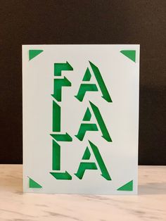 a card with the word fala written in green on it and arrows pointing up