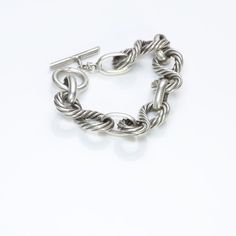 Vintage Gucci sterling silver rope link bracelet with toggle clasp. Approximate Measurements: Chain Length 7.8", Width 0.7" Weight: 71.3 Grams Made in: Italy Luxury Chain Link Bracelet With Sterling Silver Clasp, Classic Sterling Silver Cable Chain Bracelet, Classic Chain Link Jewelry With Toggle Clasp, Classic Sterling Silver Bracelet With Toggle Clasp, Classic Bracelet With Toggle Clasp And Oval Link, Luxury Link Chain Bracelet With Toggle Clasp, Elegant Chain Bracelet With Hooks And Links, Formal Bracelets With Hook And Links, Luxury Silver Jewelry With Hook And Links