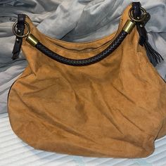 Nwot Nine West Tan Suede With Brown Leather Rope Handle And Brown Leather Tassel And Mirror Inside With Card Holder Two Pockets And A Zipper Pocket Perfect Condition Never Been Used Really Cute Medium To Large Side Interior Is Perfect Too Smoke Free Home Trendy Brown Hobo Bag With Fringe, Chic Brown Fringe Hobo Bag, Chic Brown Hobo Bag With Tassels, Casual Brown Hobo Bag With Gold-tone Hardware, Brown Tassel Bags For Daily Use, Casual Brown Shoulder Bag With Tassels, Daily Use Hobo Bag With Fringe, Brown Hobo Bag With Tassels For Travel, Brown Tassel Hobo Tote Bag