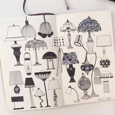 an open notebook with lamps and lamps on the pages is shown in black and white