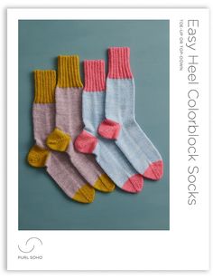 three pairs of socks with pink, blue and yellow colors on them are shown in the front