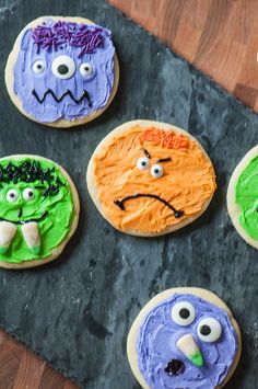 cookies decorated to look like monsters on a table