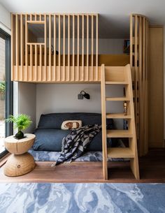 there is a loft bed with stairs to the top and bottom bunk in this room