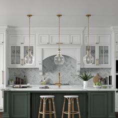 two bar stools sit at the center of a kitchen island