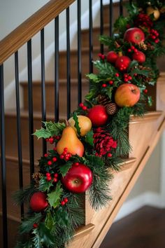 christmas garland with pomegranates and pine cones on the banister