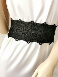 If you would like this belt in a different length or width, please, write to us. The Black wide satin belt with lace. This extra long sash is 3 inches wide and 100 inches long. The length of the lace on the belt is 20 inches. Belt material: stretch satin, lace. The satin belt is available in the following colors: 1 White 2 Ivory 3 Champagne 4 Beige 5 Peach 6 Light pink 7 Pink 8 Lilac 9 Dark pink 10 Red 11 Burgundy 12 Terracotta 13 Gray 14 Dark brown 15 Black  16 Dark green 17 Sky blue 18 Royal blue 19 Navy blue  20 Aqua blue Elegant Black Corset Belt For Party, Elegant Fitted Corset Belt With Lace Trim, Party Satin Corset Belt, Elegant Lace Wedding Corset Belt, Elegant Wedding Lace Corset Belt, Elegant Black Belt For Evening, Elegant Lace Corset Belt, Elegant Black Party Belt, Lace Corset Belt For Wedding