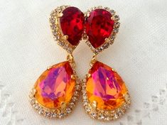 #weddings #jewelry #earrings #bridesmaidgift #bridalearrings #swarovskiearrings #chandelierearrings #statementearrings #dangleearrings #vintageearrings #dropearrings #crystalearrings #rhinestoneearrings #bridalwedding #orangeandred Drop Earrings Wedding, Crystal Chandelier Earrings, Earrings Wedding, Swarovski Earrings, Red Crystals, Stunning Earrings, Art Deco Jewelry, Earrings Dangle, Bridal Earrings