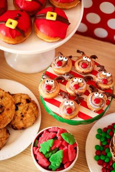 a table topped with lots of desserts and pastries