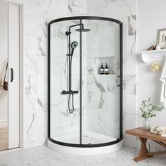 a bathroom with marble walls and flooring, including a walk - in shower stall