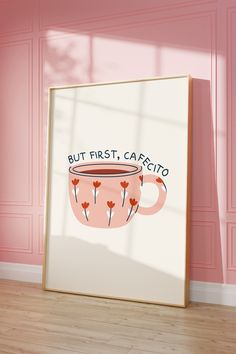 a pink wall with a coffee cup on it and the words but first, cafeto