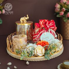 Diwali platter hamper with a candle and a variety of dry fruits, representing the essence of the festival. Diwali Faral Packing Ideas, Luxury Diwali Gift Hampers, Cinifan Taals, Diwali Gift Packing Ideas