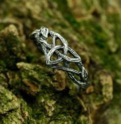 Handcrafted from sterling silver, our Fantasy Braided Tree Engagement Ring with Knot Twig Leaf is an enchanting and unusual piece inspired by the beauty of nature. Featuring a unique tree engagement design with intricate twig leaf details, this silver ring is a perfect choice for those seeking witchy jewelry with a touch of dark fairy aesthetics. A distinctive and plant-themed jewelry gift for a woman who appreciates the extraordinary. Characteristics: Metal - Recycled solid sterling silver  Fin Engagement Rings Witchy, Elvish Style Silver Ring For Gift, Handmade Silver Jewelry For Marriage, Symbolic Silver Jewelry For Weddings, Symbolic Silver Jewelry For Wedding, Witchy Engagement Ring, Tree Engagement Ring, Witchy Rings, Celtic Rings Women