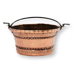 a copper colored metal bucket with handles