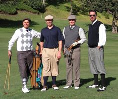 three men standing next to each other on a golf course holding golf clubs and bags