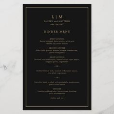 a black and gold dinner menu card on a white marble tablecloth with the words, l m