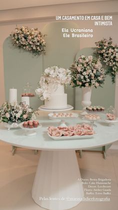 the table is covered with flowers and desserts