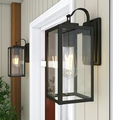 an outdoor light hanging on the side of a house