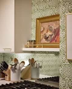 the kitchen counter is covered with utensils