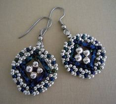 a pair of blue and white beaded earrings