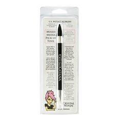 the ink pen is black and has a pink flower on it's tip, in an open package