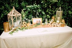 a table topped with pictures and candles