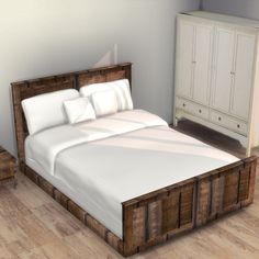 a large bed sitting on top of a hard wood floor next to a white dresser