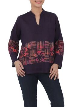 Made from 100% cotton voile this exotic blouse features a hand-painted batik design by Chomsuda Samana of Thailand. Rich purple in color the comfortable lightweight tunic has a tie-dyed pink floral and striped pattern highlighting the motifs long sleeves and an open mandarin collar. Batik Ideas, Batik Blouse, Spirit Clothing, Fair Trade Clothing, Blouse Batik, Batik Design, Batik Pattern, Samana, Rich Purple